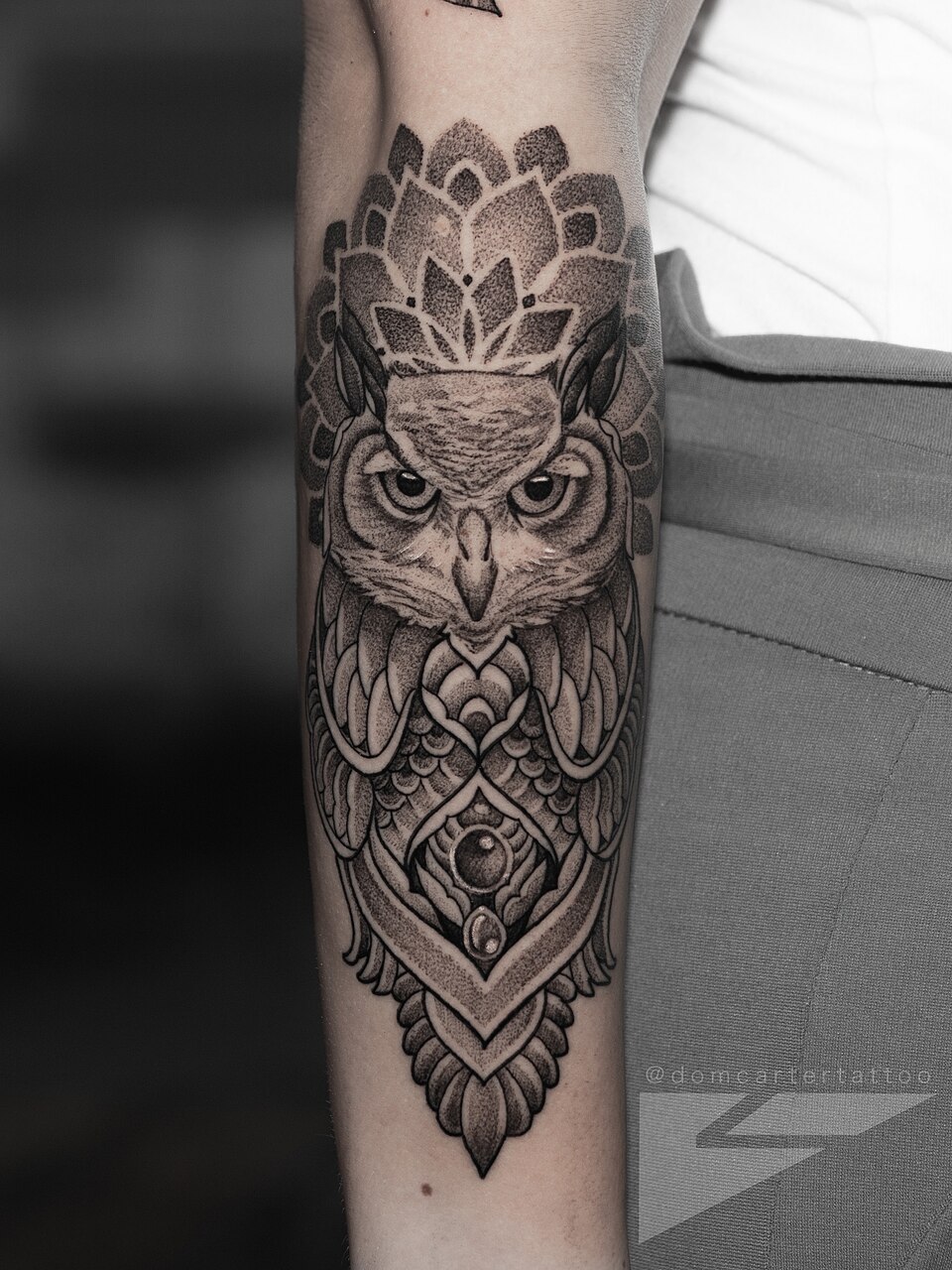 An ornamental owl tattoo by Dom Carter.