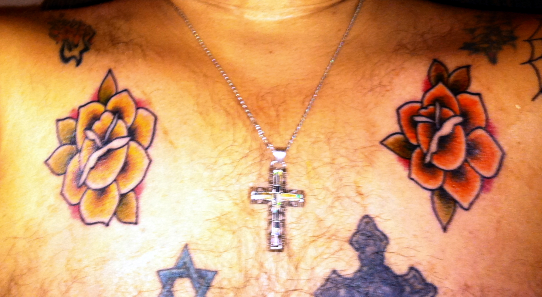 Traditional rose tattoos by Josh Shortridge, Ancient Art Tattoo Studio.