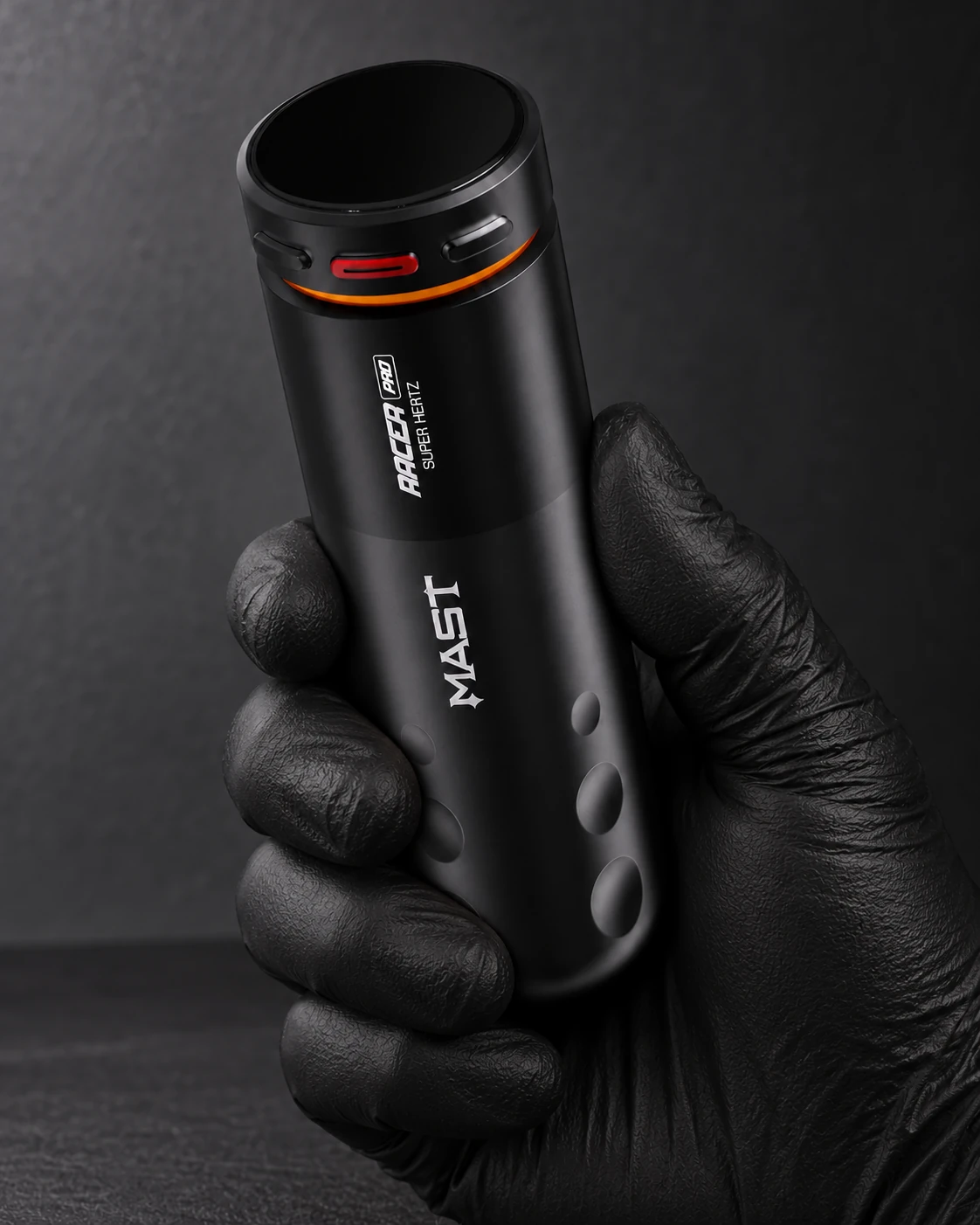 Mast Racer Pro · black wireless tattoo machine held around its grip in a gloved hand