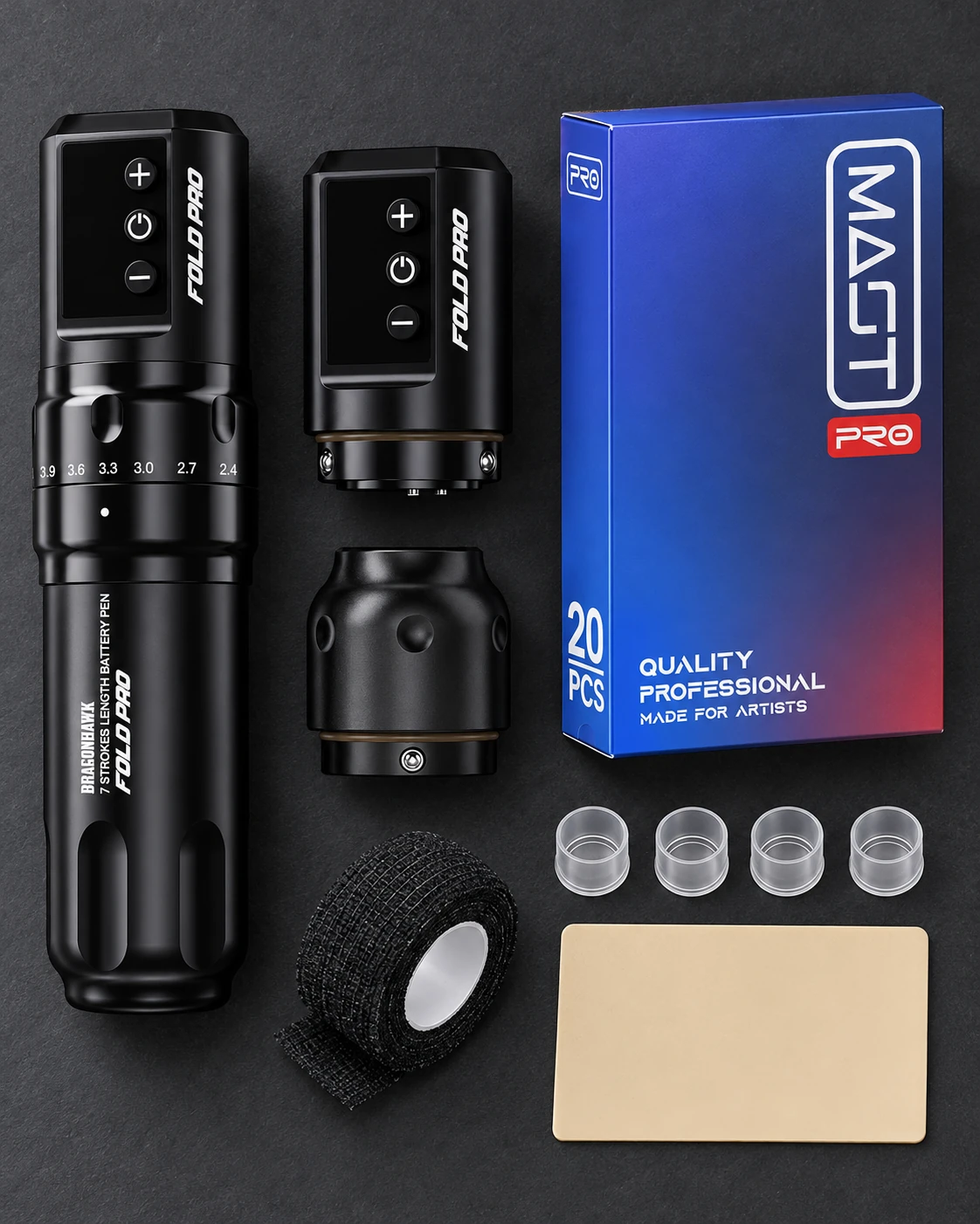 Dragonhawk Fold Pro · two-battery and 20-cartridge kit with accessories on a studio worktable