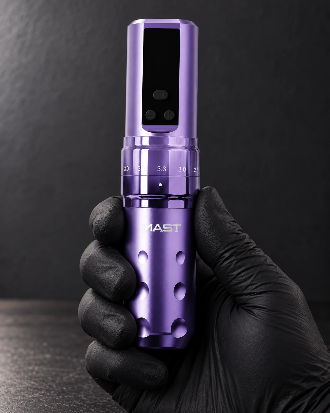 Mast Fold2 Pro · purple wireless tattoo machine held around its grip in a gloved hand