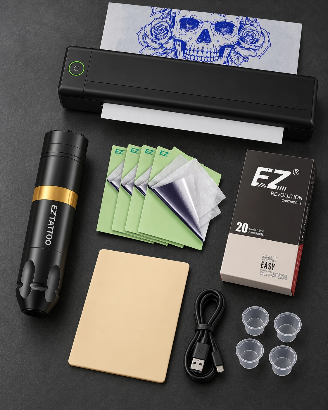 EZ Tattoo · kit con máquina y termocopiadora con accesorios sobre una mesa de estudio