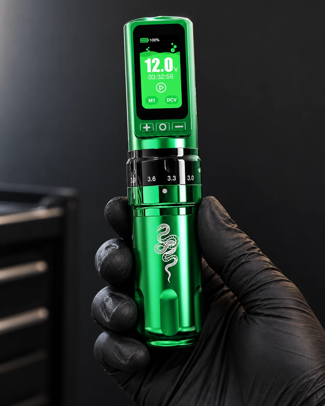 green Fold Pro Snake held in a black gloved hand